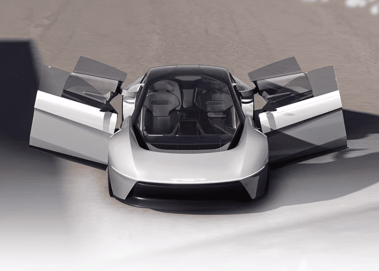 Chrysler Halcyon Concept car parked in desert landscape, sleek design, expansive glass canopy reflecting sunset.