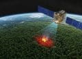 AI-powered FireSat satellite scanning a forest from space, detecting a wildfire with thermal imaging and real-time data processing.