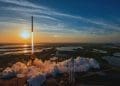 SpaceX Falcon 9 rocket launching Crew-10 mission at sunset with smoke and flames