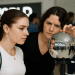 Futuristic Orb scanning a user's eye in a retail store, showcasing Worldcoin's biometric identity and Visa debit card expansion in the US.
