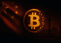Fractured Bitcoin symbol dissolving in front of the Chinese flag and Shanghai skyline, symbolizing China's 2025 crypto ownership ban.