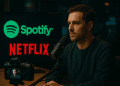 AI-generated image showing a podcast host recording in a sleek studio with Spotify and Netflix logos illuminated on screens behind him, representing the collaboration bringing video podcasts to streaming platforms.