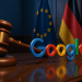 Gavel striking beside the Google logo in a German courtroom with EU and German flags, symbolizing the €572M antitrust ruling.