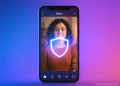 Smartphone showing a protected Reels video with a glowing shield icon, symbolizing Meta’s new Content Protection tool