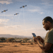 A person using a smartphone in a rural African landscape as satellites provide direct-to-cell mobile connectivity via Starlink.