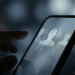 Teen access to AI characters restricted on Meta platforms, shown through a smartphone interface with fading AI avatars.