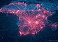 A conceptual digital map of Africa showing an expansive, glowing network of interconnected data nodes and lines in raspberry pink (#F13E5F), emanating from South Africa to symbolize the growth of xneelo’s hosting infrastructure.