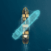 A top-down, minimalist view of an MSC container ship at sea with a glowing cyan digital ghost outline shifting away from the hull to represent GPS spoofing and electronic warfare.