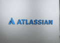 Atlassian logo displayed on a sleek, brushed metal surface, representing tech innovation and AI integration.