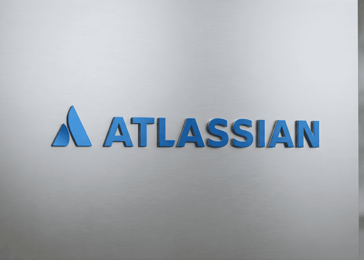 Atlassian logo displayed on a sleek, brushed metal surface, representing tech innovation and AI integration.