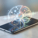 A minimalist editorial rendering of a smartphone displaying a glowing AI brain and voice waveforms, representing Google's offline-only Eloquent voice dictation app.