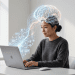 A person working on an Apple laptop with a holographic digital brain interface visualised above them, representing the integration of human cognition and AI.