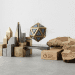 A minimalistic 3D editorial design featuring a stylized geometric crypto token levitating between a modern brass and stone skyline and a wooden map of Africa, representing GenZ driving the next crypto revolution.