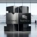 Minimalist editorial 3D graphic showing the Payward wordmark engraved on a sleek brushed metal block alongside the US Tech Force logo, set against a modern atrium background with a view of the White House.