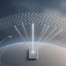 Minimalist 3D editorial illustration of a smartphone connected by light beams to a satellite constellation above Earth, representing Amazon's direct-to-phone network challenging SpaceX.