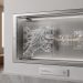 A minimalistic 3D gallery display featuring a holographic AI hand manipulating glass tiles next to Web3 digital assets, showcasing Meta's branding.