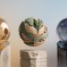 Three futuristic, 3D abstract spheres representing OpenAI's GPT-5.6 models—Sol, Terra, and Luna—hovering over minimalist pedestals with subtle OpenAI logos against a clean, gradient background.