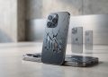 A high-quality 3D render of modern smartphones with cracked glass backs depicting a declining economic chart, symbolising the 11% drop in smartphone shipments for Q2 2026.
